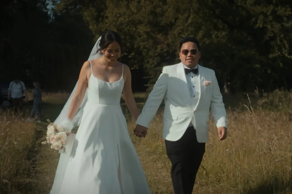 Bride and groom walking hand in hand at Schloss Fridau wedding venue in Austria